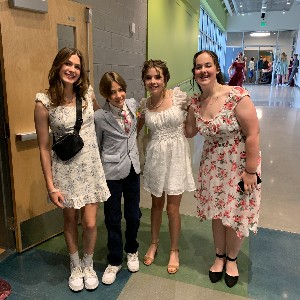 Four students pose for picture before entering the dance.