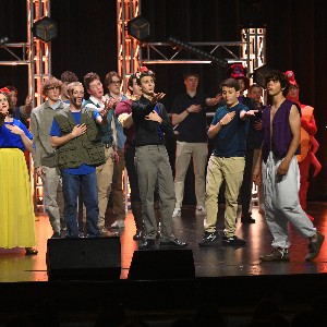 Students singing on stage