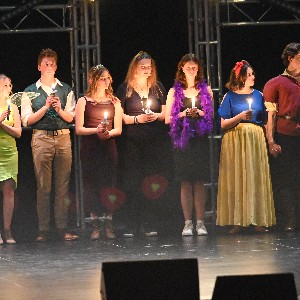 Students holding candles