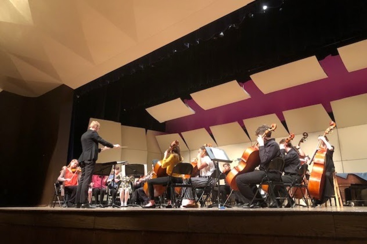 The PCHS Orchestra performs on stage.