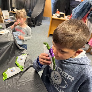 Students smelling items.