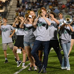 Marching band horns performing in halftime show