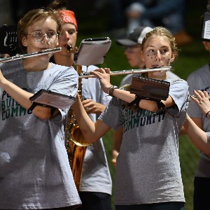 Flutists performing at football game