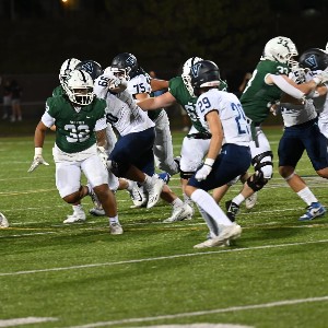 Football player #4 running the ball down the field