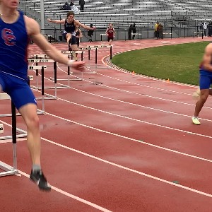 Hurdler jumps over the hurdle