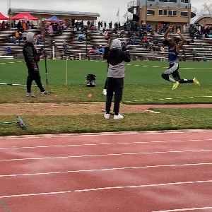 Student competing in the long jump