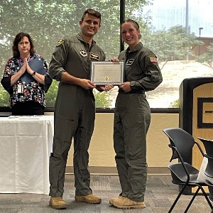 Two people holding certificate