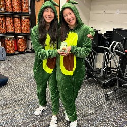 Two students dressed as avocados for Trunk or Treat 2022