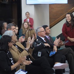 Board of Education Director Nicole Konz smiles while receiving recognition at the Hall of Excellence