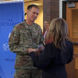 Col. William Sullivan receives his star pin at the 2022 Hall of Excellence