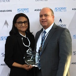 Dr. Mary Thurman poses with Superintendent Tom Gregory at the 2022 Hall of Excellence