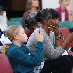 Dr. Mary Thurman's family catches her speech on their smart phones