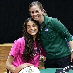 Girls Basketball Coach and student-athlete pose for picture.