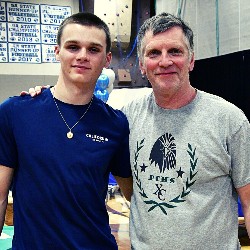 Cross Country Coach and athlete pose for camera