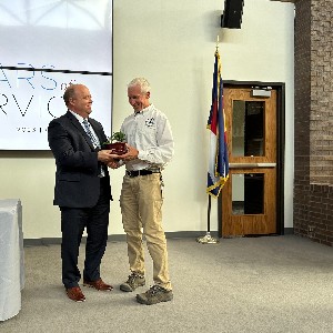 Superintendent Tom Gregory hands out awards at the 2023 Years of Service ceremony