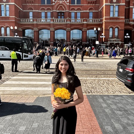 Parnika holding her bouquet of yellow roses