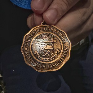 Medal that says, "Colorado High School Activities Association"