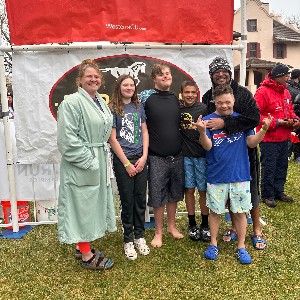 Group smiling after participating in the Polar Plunge