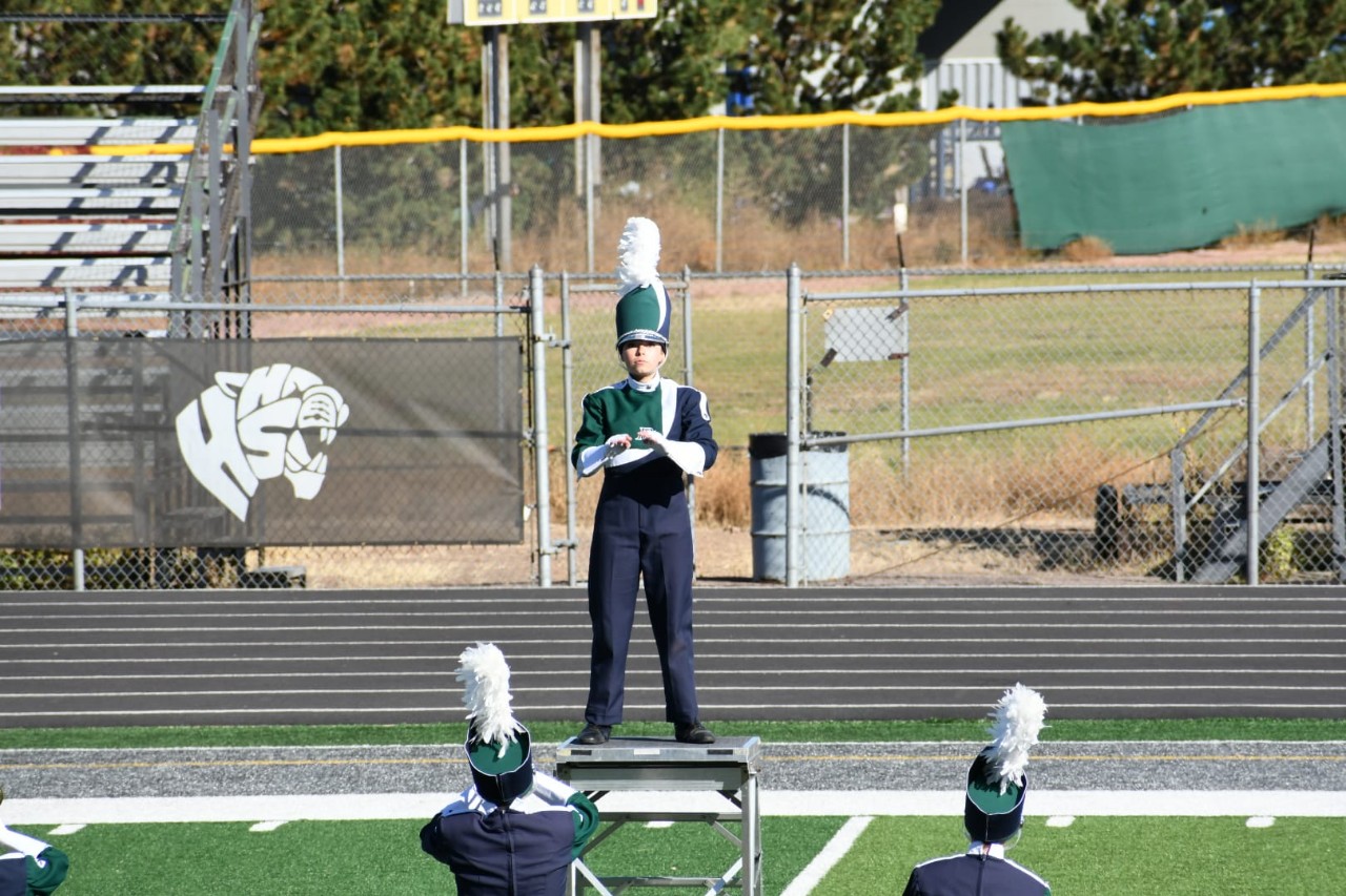 Drum major conducts the band