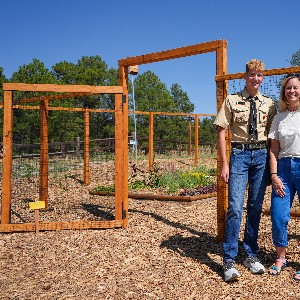 Andrew Vider and principal Robin Lowery smile for a photo outside the garden