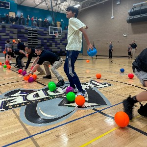 students race for dodgeballs