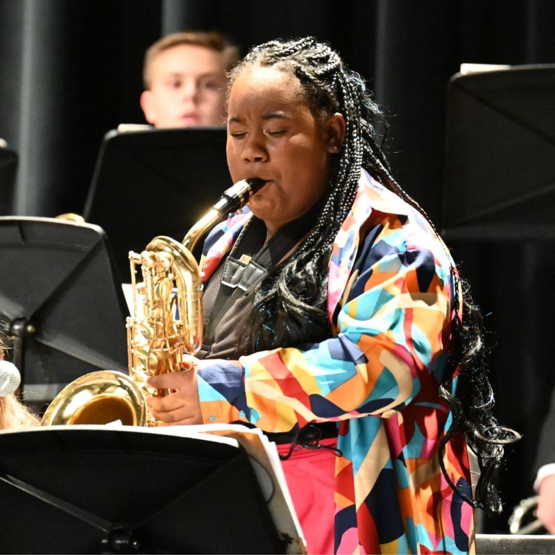 Student playing baritone saxophone 