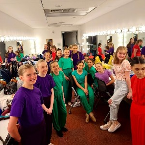 Students gathered in dressing room.