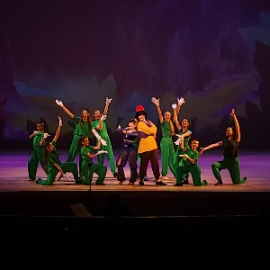 Students performing on stage.