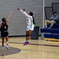 Player shooting the ball - feet off floor in the air