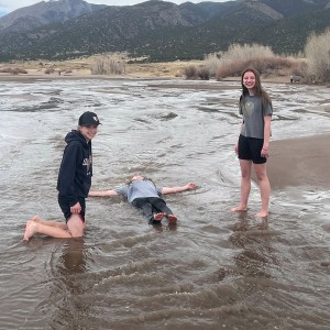 Photo from Rodney Pierson of students playing in the water at the dunes