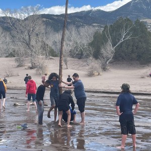 Photo from Rodney Pierson of students playing in the water at the dunes 