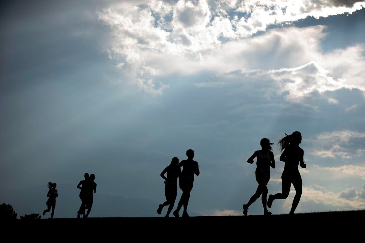 Silhouettes of students running.