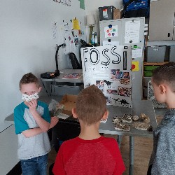 Students looking at science fair project