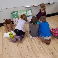 Students looking at science fair project