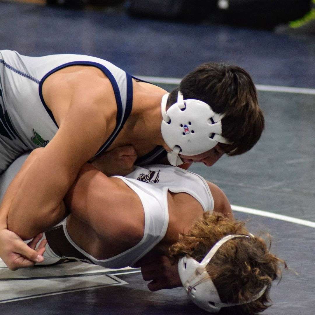 Wrestler with hold on opponent during competition
