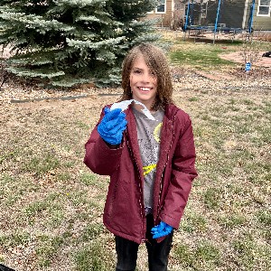 Fifth graders pick up trash.