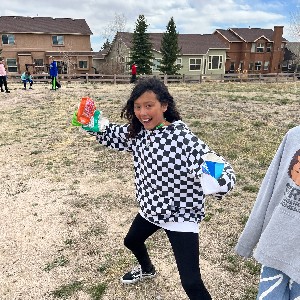 Fifth graders pick up trash.