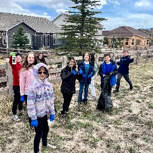 Fifth graders pick up trash.