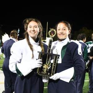 Drum Majors pose with trophies