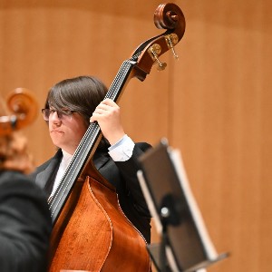 Student playing upright bass