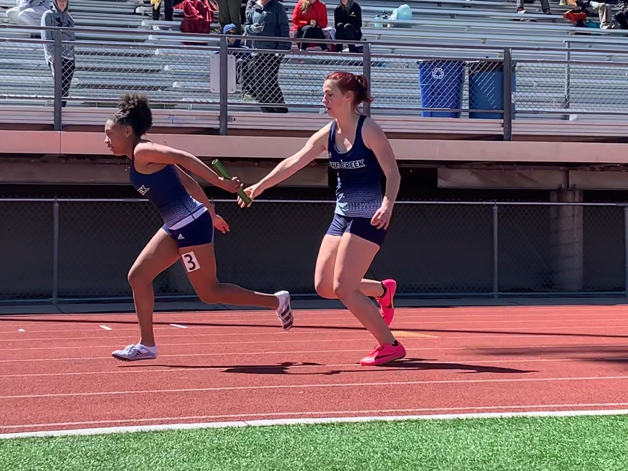 Baton handoff during girls relay race