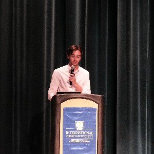 Student at podium with microphone