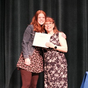 Student and Theatre Director holding certificate