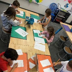 Students drawing self-portraits.