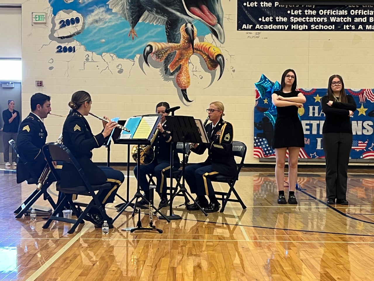 ASL students signed the National Anthem while it was being performed by the 101st Army National Guard Woodwind quartet.