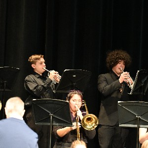 Students playing trombones and trumpets