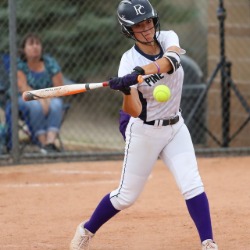 A PCHS softball player swings at a ball during a game.