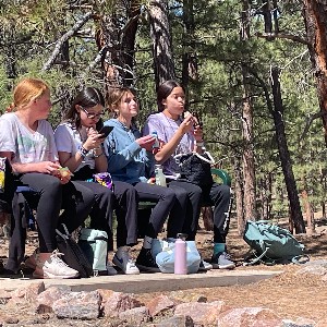 Students eating lunch on the bench 