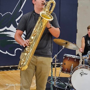 Baritone saxophone player performing