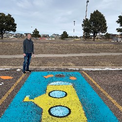 Parking spot painted like a yellow submarine